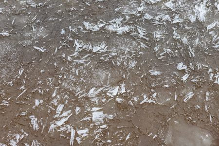 Spring melting of ice, springtime thaw. Pieces of ice on the riverの写真素材