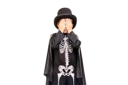 Studio portrait of little boy in Halloween costume against white backgroundの写真素材