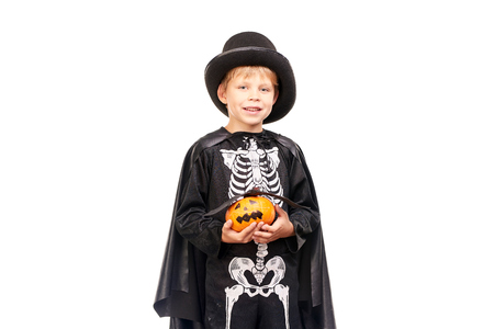 Studio portrait of little boy in Halloween costume against white backgroundの写真素材