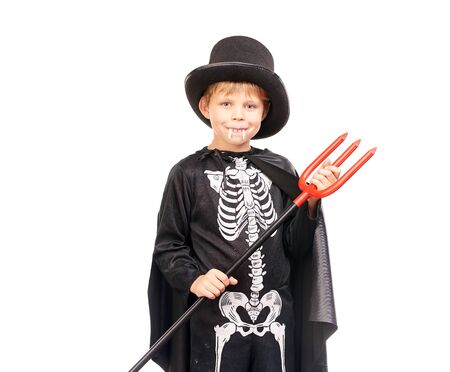Studio portrait of little boy in Halloween costume against white backgroundの写真素材