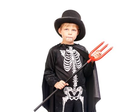 Studio portrait of little boy in Halloween costume against white backgroundの写真素材