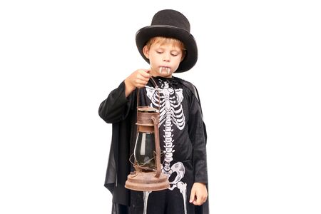 Studio portrait of little boy in Halloween costume against white backgroundの写真素材