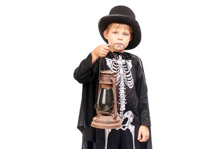 Studio portrait of little boy in Halloween costume against white backgroundの写真素材