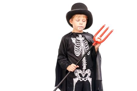Studio portrait of little boy in Halloween costume against white backgroundの写真素材