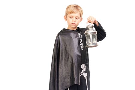 Studio portrait of little boy in Halloween costume against white backgroundの写真素材