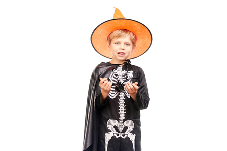 Studio portrait of little boy in Halloween costume against white backgroundの写真素材