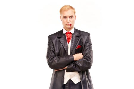 Portrait of handsome young vampire against white backgroundの写真素材