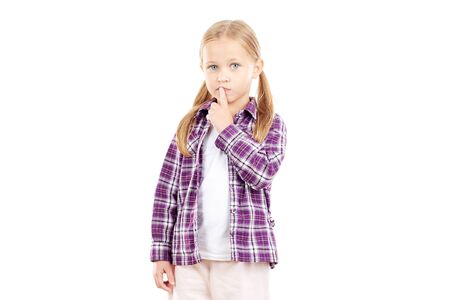 Portrait of little blonde girl in checked shirt on white backgroundの写真素材