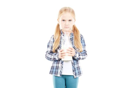 Portrait of beautiful little girl in checked shirt against white backgroundの写真素材