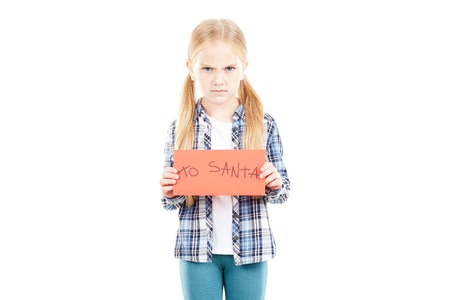 Portrait of little girl holding envelope with letter to Santaの写真素材