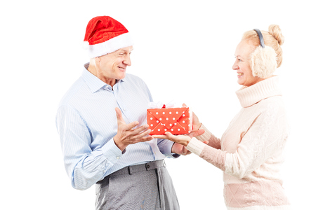 Portrait of cute senior couple celebrating Christmasの写真素材