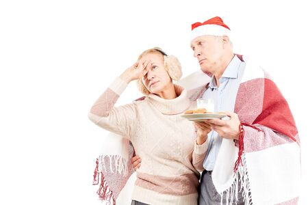 Portrait of cute senior couple celebrating Christmasの写真素材