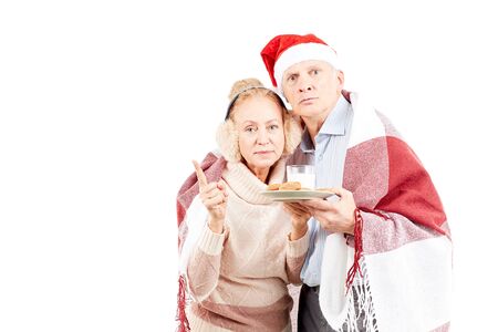 Portrait of cute senior couple celebrating Christmasの写真素材