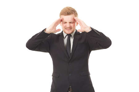 Portrait of stressed businessman in black suit on white backgroundの写真素材