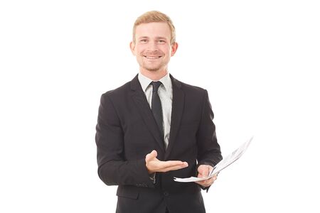 Portrait of young manager in black suit holding document on white backgroundの写真素材