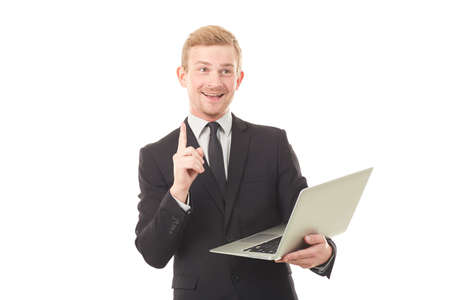 Portrait of manager holding open laptop on white backgroundの写真素材