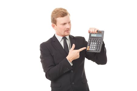 Portrait of businessman in black suit holding calculatorの写真素材