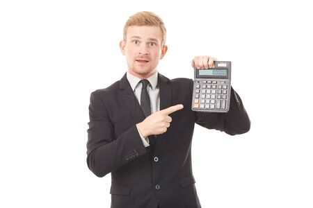 Portrait of businessman in black suit holding calculatorの写真素材