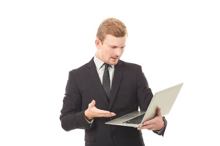 Portrait of manager holding open laptop on white backgroundの写真素材