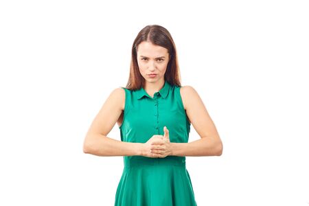 Portrait of emotional young woman in emerald green dress on white backgroundの写真素材