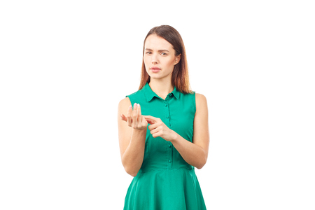 Portrait of emotional young woman in emerald green dress on white backgroundの写真素材