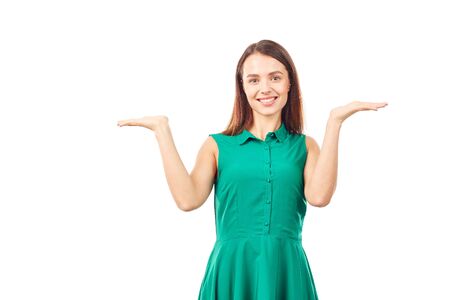 Portrait of emotional young woman in emerald green dress on white backgroundの写真素材