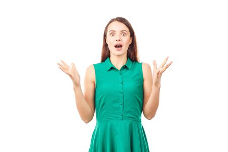 Portrait of emotional young woman in emerald green dress on white backgroundの写真素材