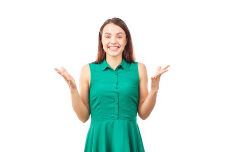 Portrait of emotional young woman in emerald green dress on white backgroundの写真素材