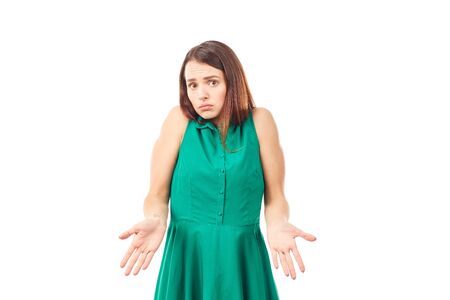Portrait of emotional young woman in emerald green dress on white backgroundの写真素材