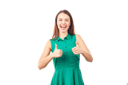 Portrait of emotional young woman in emerald green dress on white backgroundの写真素材