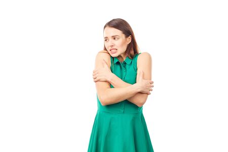 Portrait of emotional young woman in emerald green dress on white backgroundの写真素材