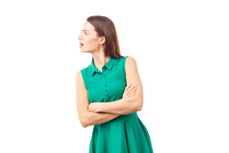 Portrait of emotional young woman in emerald green dress on white backgroundの写真素材