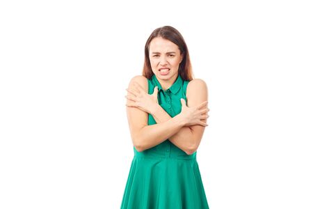 Portrait of emotional young woman in emerald green dress on white backgroundの写真素材