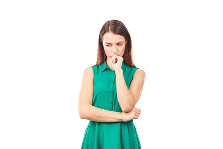 Portrait of emotional young woman in emerald green dress on white backgroundの写真素材