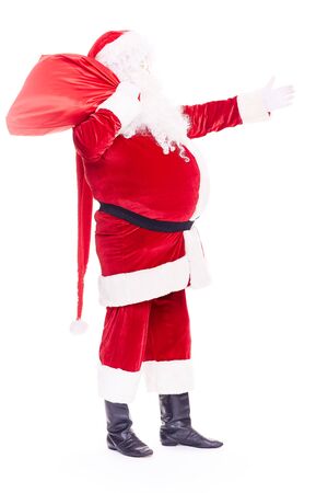 Portrait of Christmas character Santa Claus in traditional costume with red sack on white backgroundの写真素材