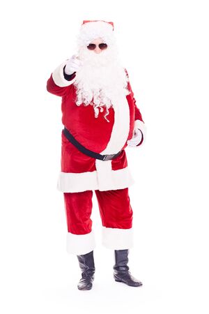 Portrait of cool Santa Claus in traditional costume wearing sunglasses on white backgroundの写真素材