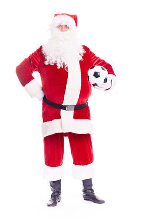 Portrait of Santa Claus holding soccer ball on white backgroundの写真素材
