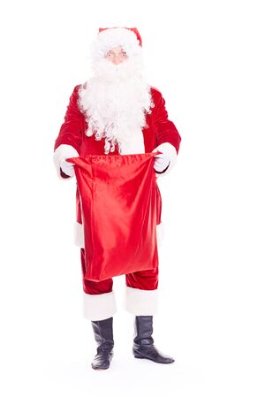 Portrait of Christmas character Santa Claus in traditional costume with red sack on white backgroundの写真素材