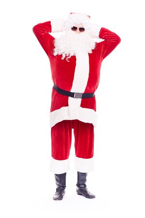 Portrait of cool Santa Claus in traditional costume wearing sunglasses on white backgroundの写真素材