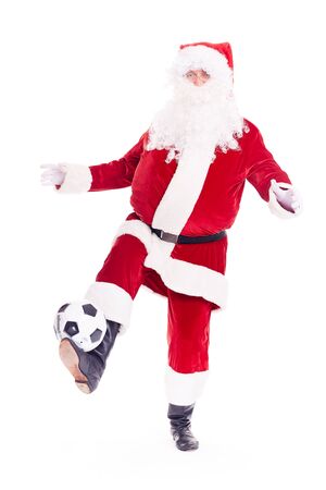 Portrait of Santa Claus playing soccer ball on white backgroundの写真素材