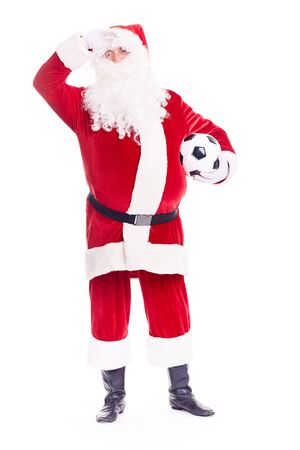 Portrait of Santa Claus holding soccer ball on white backgroundの写真素材