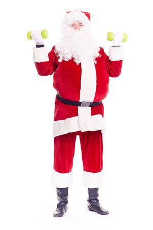 Isolated portrait of Santa Claus exercising with dumbbellsの写真素材