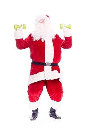 Isolated portrait of Santa Claus exercising with dumbbellsの写真素材