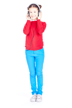 Portrait of Asian girl listening to music through headphonesの写真素材
