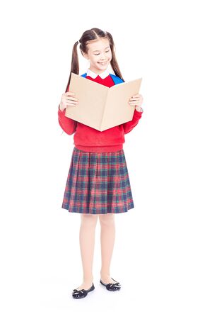 Full length portrait of Korean schoolgirl holding open notebookの写真素材