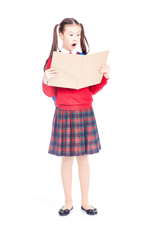 Full length portrait of Korean schoolgirl holding open notebookの写真素材