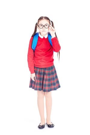 Portrait of nearsighted Asian schoolgirl wearing eyeglasses on white backgroundの写真素材