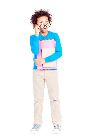 Portrait of cute curly-haired Latin American elementary student wearing eyeglassesの写真素材