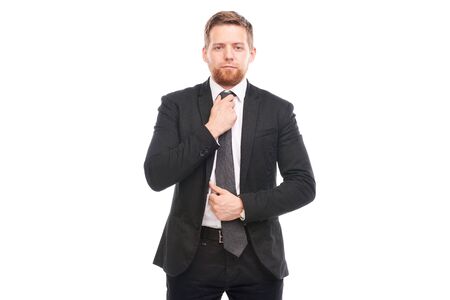 Portrait of young businessman wearing suit, white shirt and necktieの写真素材