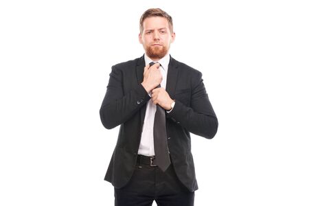 Portrait of young businessman wearing suit, white shirt and necktieの写真素材